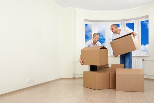 Stpauls home moving team packing boxes and wrapping fragile items