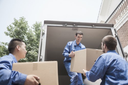 Team loading donated furniture for charity reuse and recycling