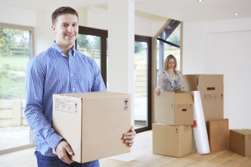 Commercial moving team organizing desks and equipment for an office move in Stpauls