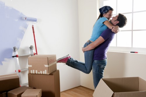 Professional removal team handling household moving boxes in Stpauls