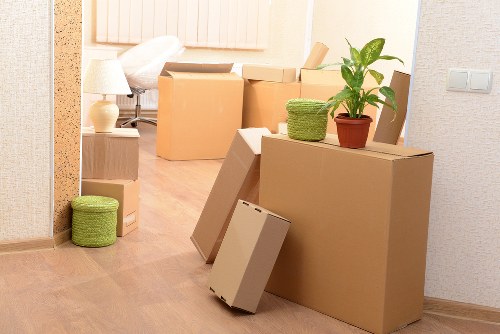 Moving team preparing fragile household items during packing in Stpauls